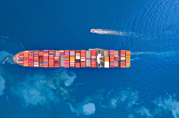 Top view Container ship loading and unloading in sea port, Aerial view of business logistic import and export freight transportation by container ship in harbor, Container loading Cargo freight ship,
