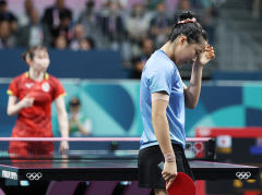 고개 숙인 '탁구 신동' 삐약이…동메달 결정전서 아쉬운 패